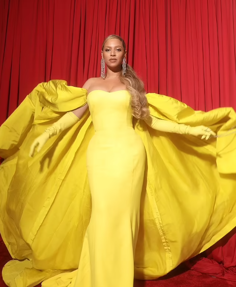 Beyoncé in a gold cloak by Elsa Schiaparelli